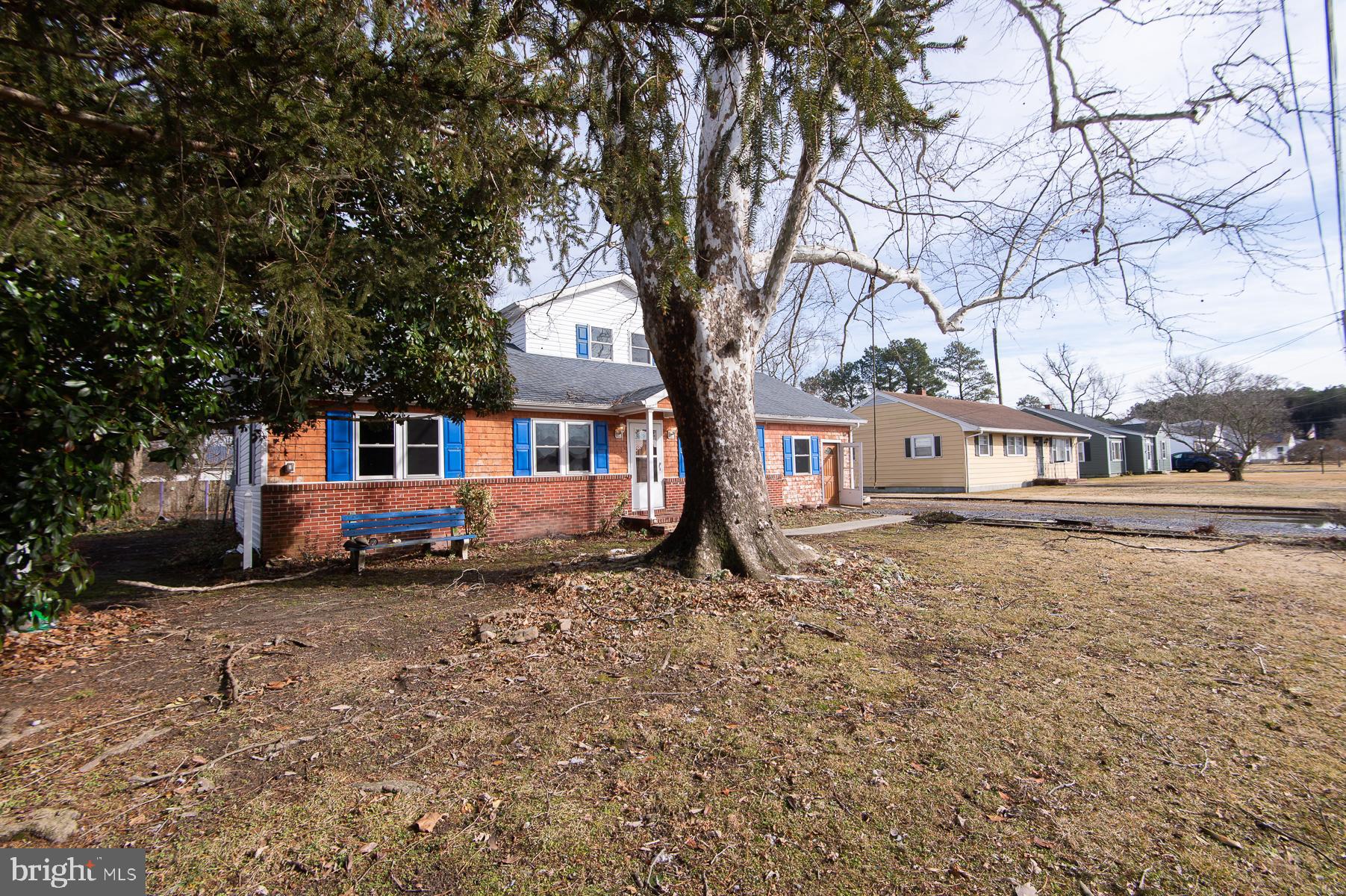 1210 Stone Boundary Road Cambridge, MD 21613 - Photo 48 of 63 a front view of a house with a yard