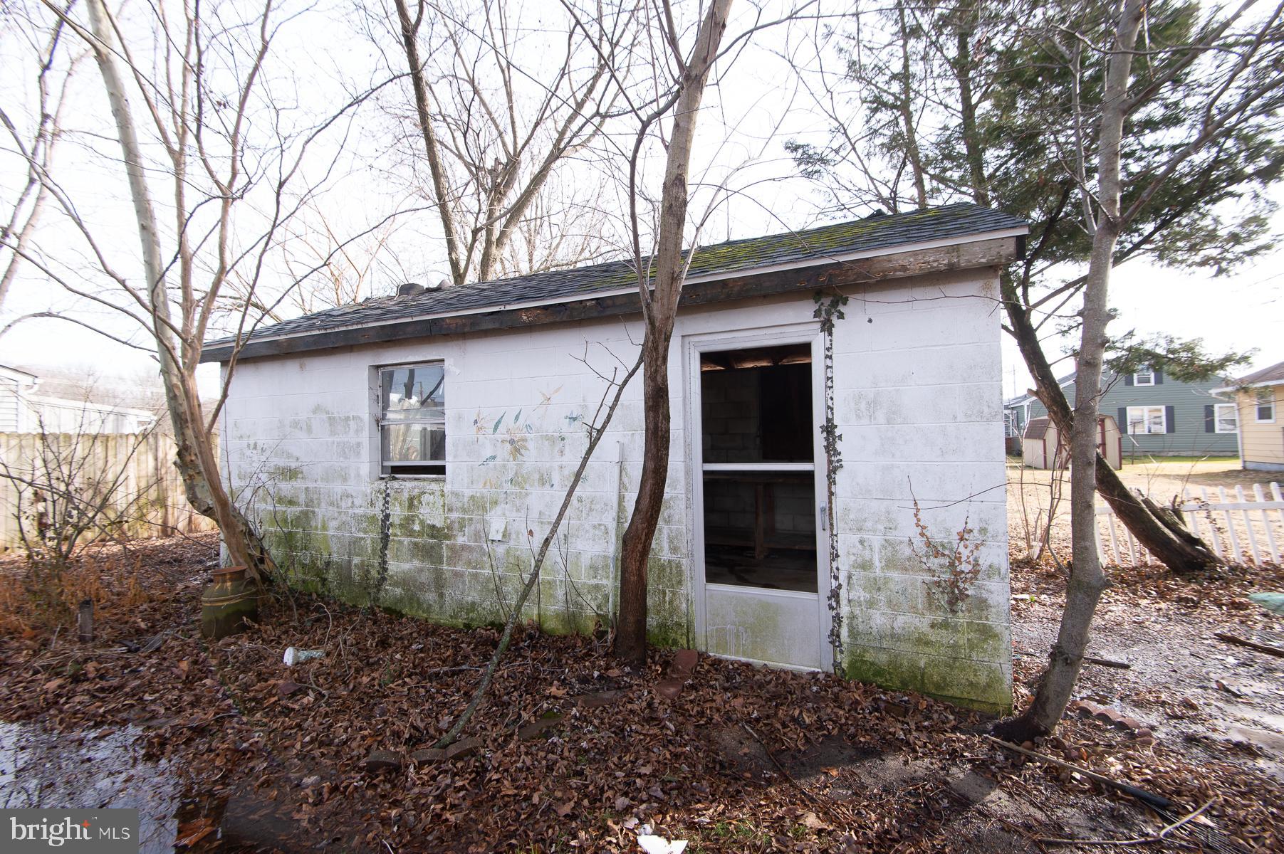 1210 Stone Boundary Road Cambridge, MD 21613 - Photo 53 of 63 a view of a house with a yard