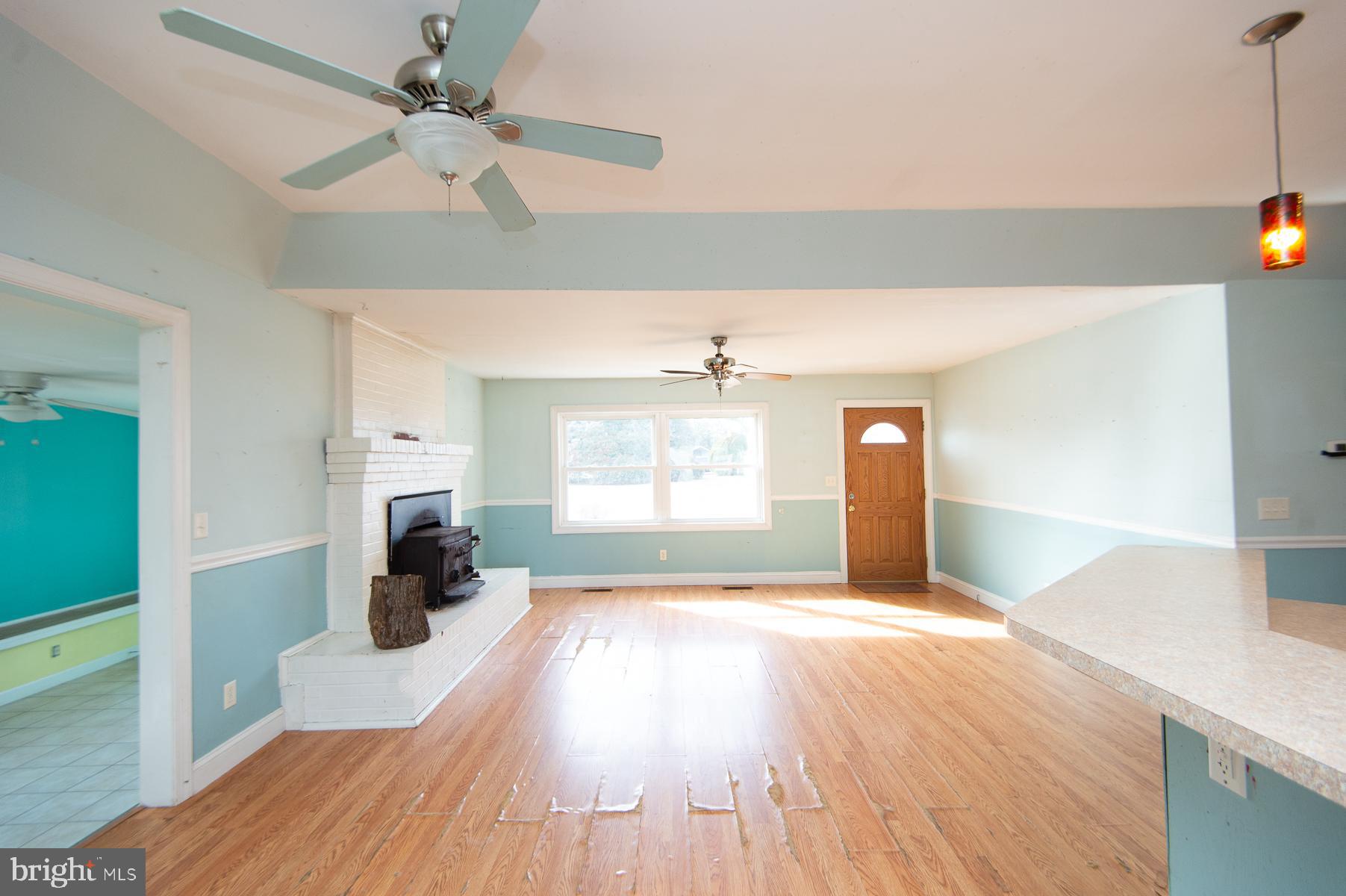 1210 Stone Boundary Road Cambridge, MD 21613 - Photo 7 of 63 a view of a livingroom with a window and a kitchen