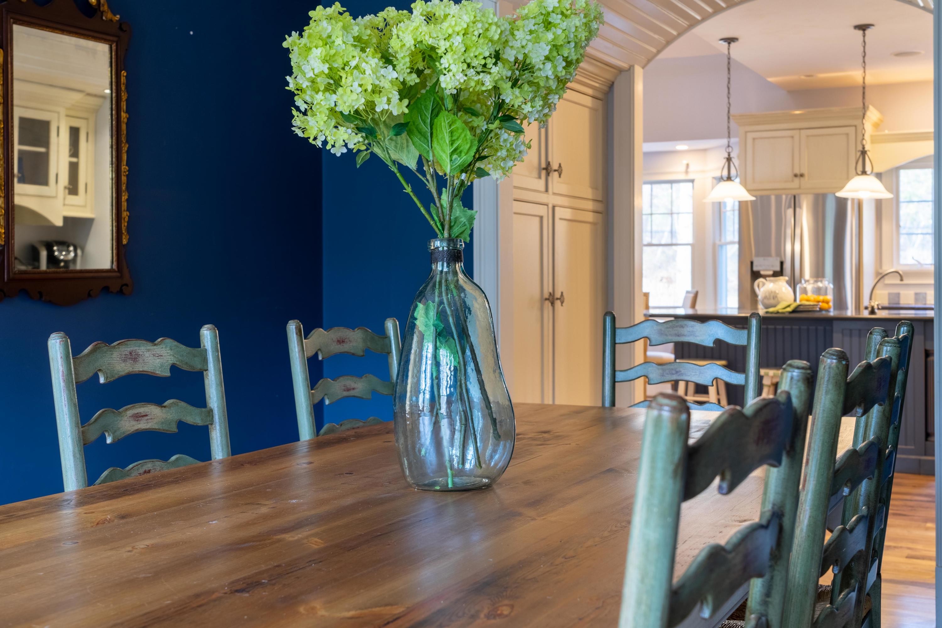 5 Pasture Road Cataumet, MA 02534 - Photo 14 of 52 a view of a dining room with furniture and a potted plant