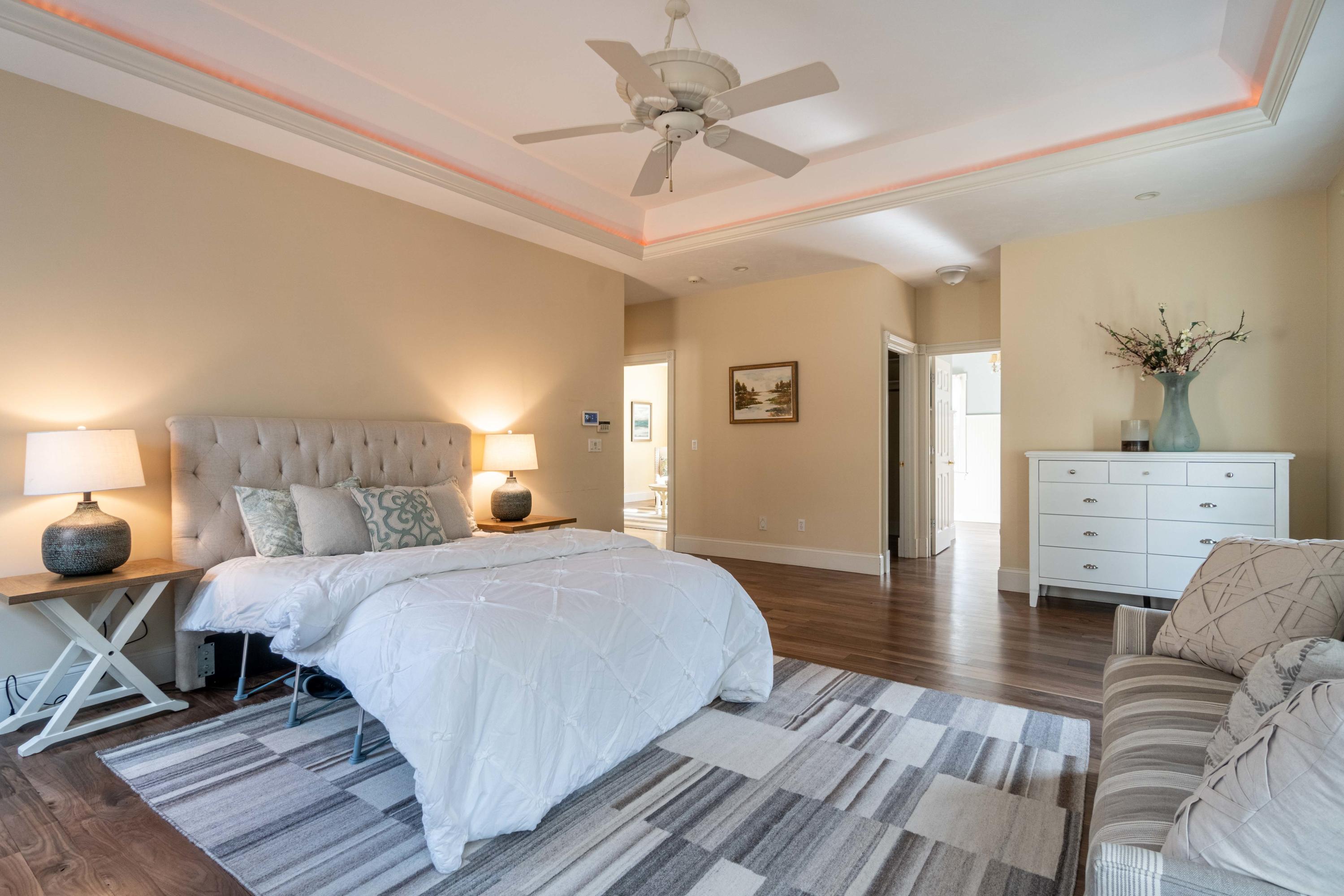 5 Pasture Road Cataumet, MA 02534 - Photo 19 of 52 a bedroom with a bed and wooden floor