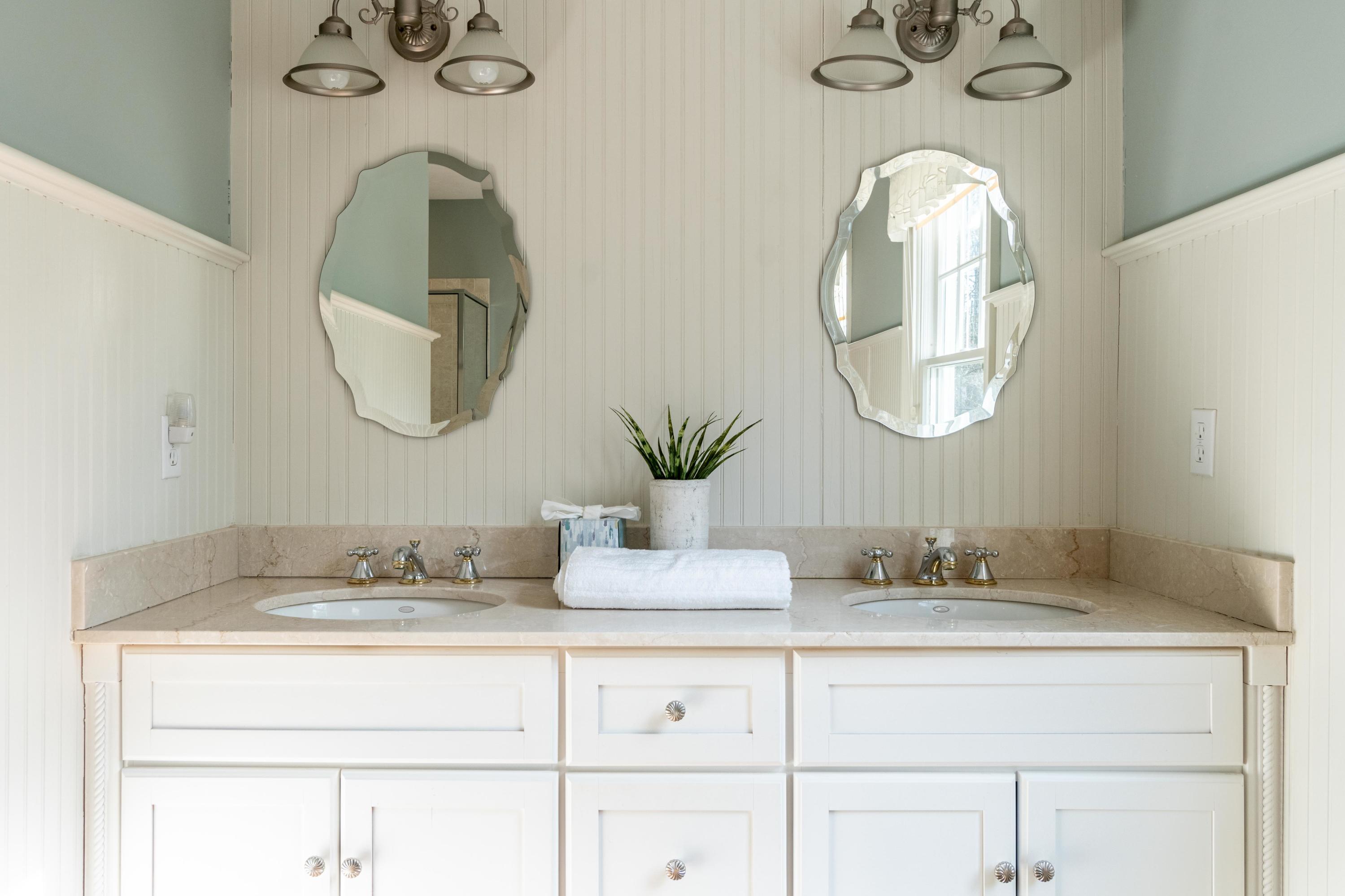 5 Pasture Road Cataumet, MA 02534 - Photo 20 of 52 a bathroom with a double vanity sink and a mirror