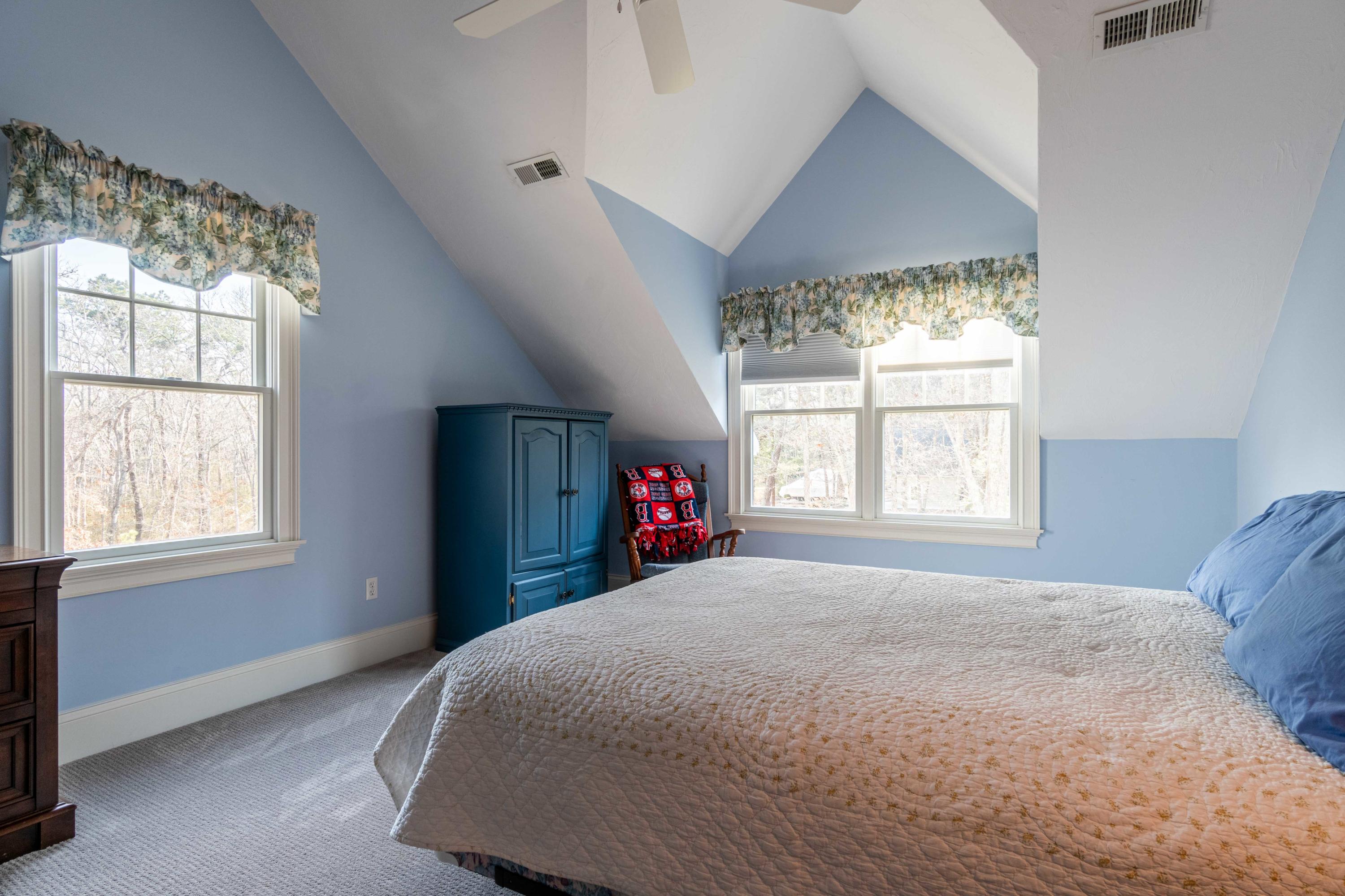 5 Pasture Road Cataumet, MA 02534 - Photo 26 of 52 a bed sitting in a bedroom next to a window