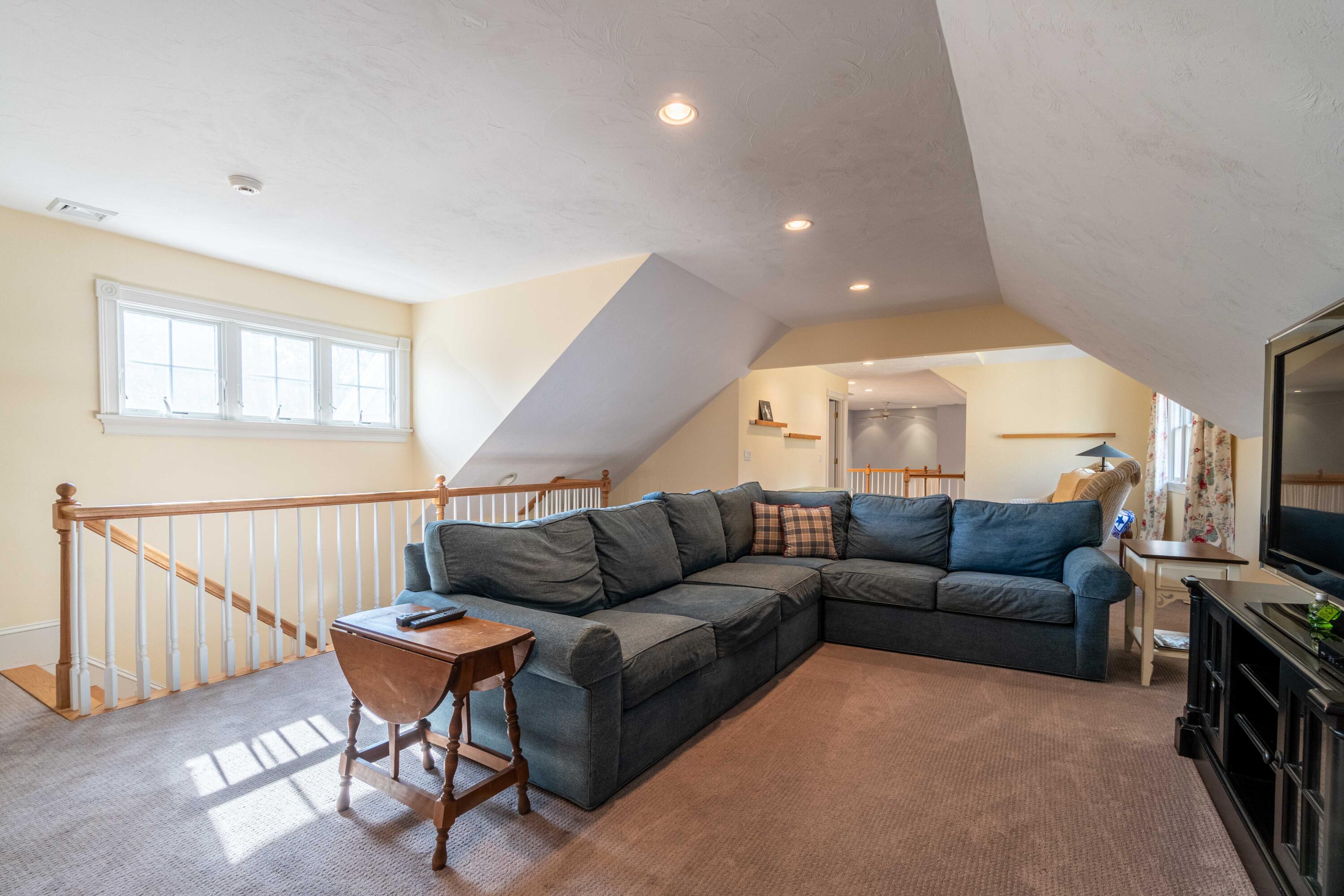 5 Pasture Road Cataumet, MA 02534 - Photo 28 of 52 a living room with furniture a ceiling fan and a window