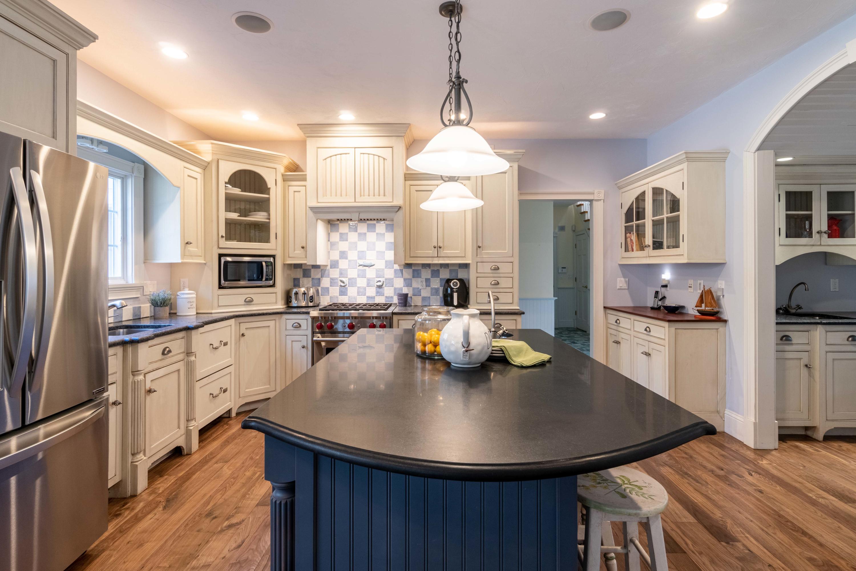 5 Pasture Road Cataumet, MA 02534 - Photo 10 of 52 a kitchen with stainless steel appliances granite countertop a sink a stove and refrigerator