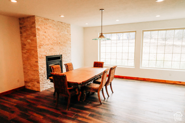 985 Russell Road Hatch, UT 84735 - Photo 10 of 30 Dining space featuring a stone fireplace, recessed lighting, and dark wood finished floors