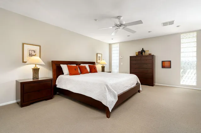 a bedroom with bed and window