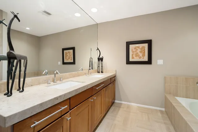 a bathroom with a sink a vanity and a mirror