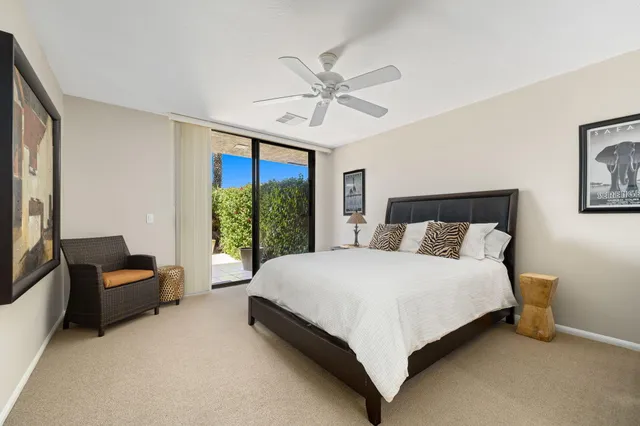 a bedroom with a bed and a couch