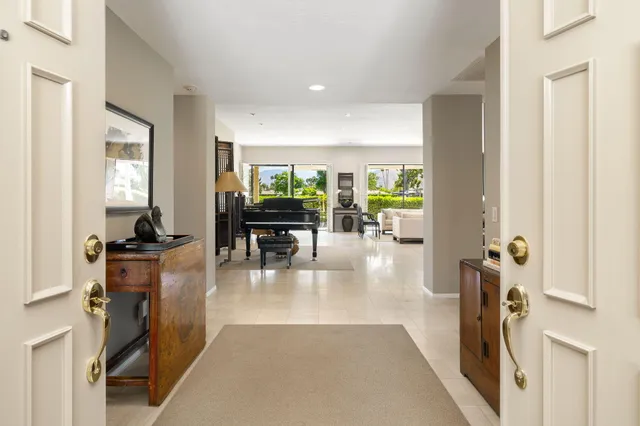 a lobby with furniture and floor to ceiling window