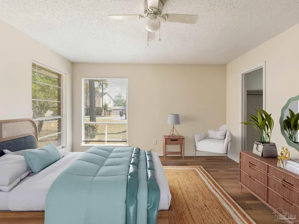 a bedroom with a large bed and a couch