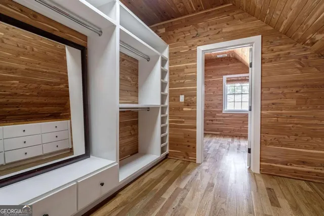 a kitchen with stainless steel appliances granite countertop a stove top oven a sink dishwasher and a refrigerator