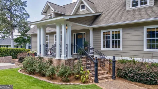 a view of a living room with hardwood floor and a flat screen tv
