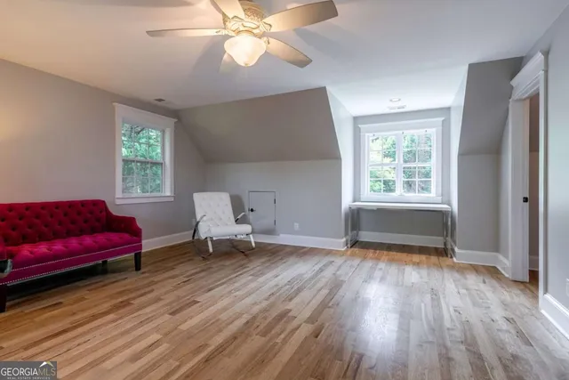 a bedroom with a large bed and a flat tv screen on a dresser