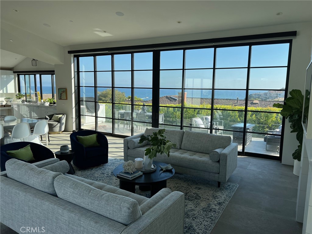 809 Emerald Bay Laguna Beach, CA 92651 - Photo 16 of 20 a living room with furniture and a large window