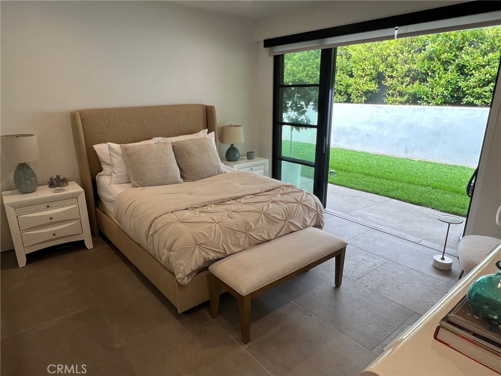 809 Emerald Bay Laguna Beach, CA 92651 - Photo 20 of 20 a bed sitting in a bedroom next to a window