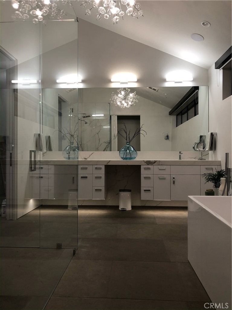 809 Emerald Bay Laguna Beach, CA 92651 - Photo 5 of 20 a kitchen with kitchen island a sink stainless steel appliances and cabinets