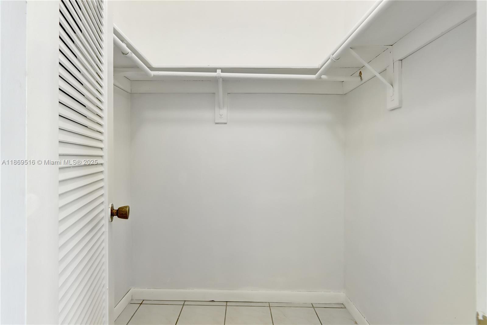 8133 Southwest 152nd Court Miami, FL 33193 - Photo 11 of 20 a view of a room with shelf