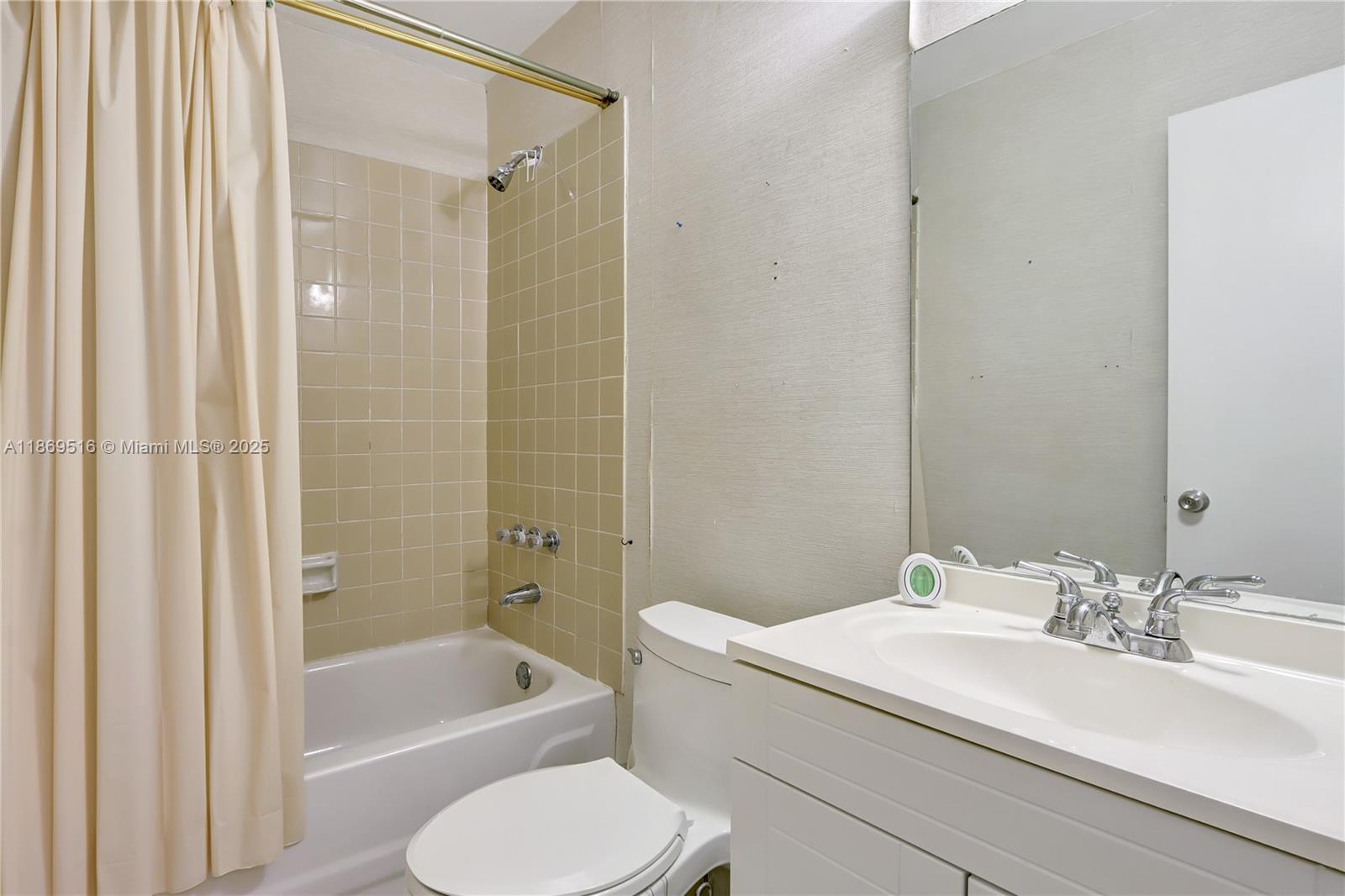 8133 Southwest 152nd Court Miami, FL 33193 - Photo 17 of 20 a bathroom with a granite countertop sink toilet and shower
