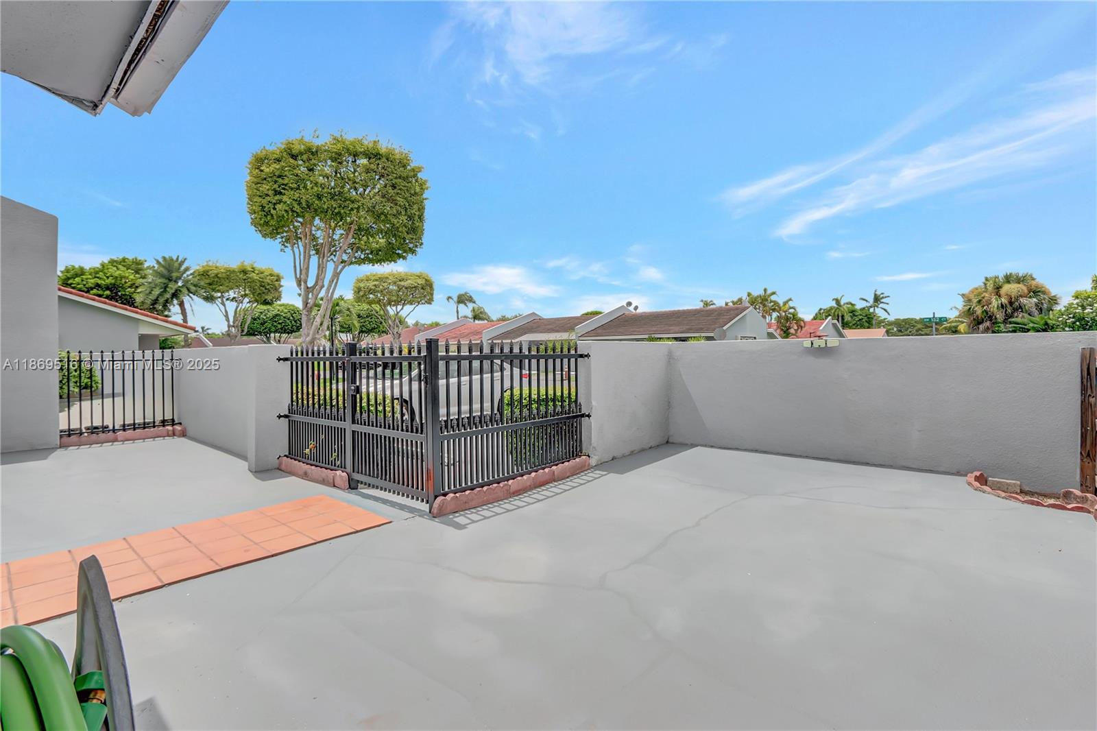 8133 Southwest 152nd Court Miami, FL 33193 - Photo 2 of 20 a view of entryway gate of a house