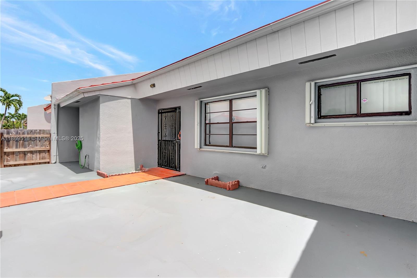 8133 Southwest 152nd Court Miami, FL 33193 - Photo 3 of 20 a bedroom with a bed and a window