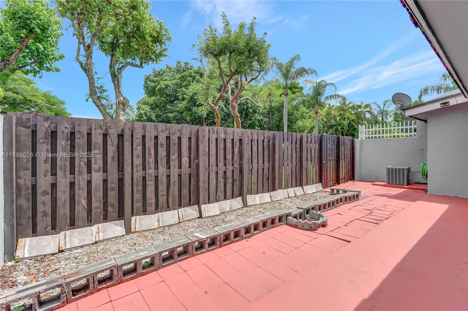 8133 Southwest 152nd Court Miami, FL 33193 - Photo 4 of 20 a backyard of a house with wooden fence