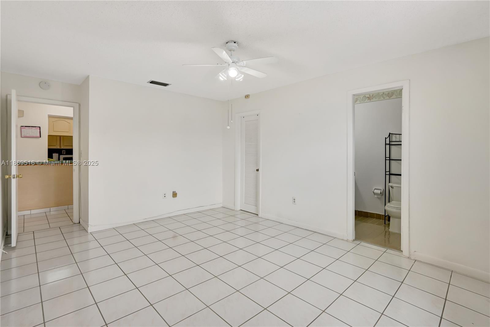 8133 Southwest 152nd Court Miami, FL 33193 - Photo 10 of 20 a view of an empty room and window