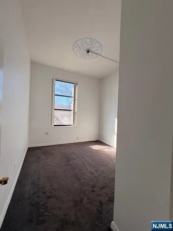 a kitchen with stainless steel appliances a refrigerator and a stove
