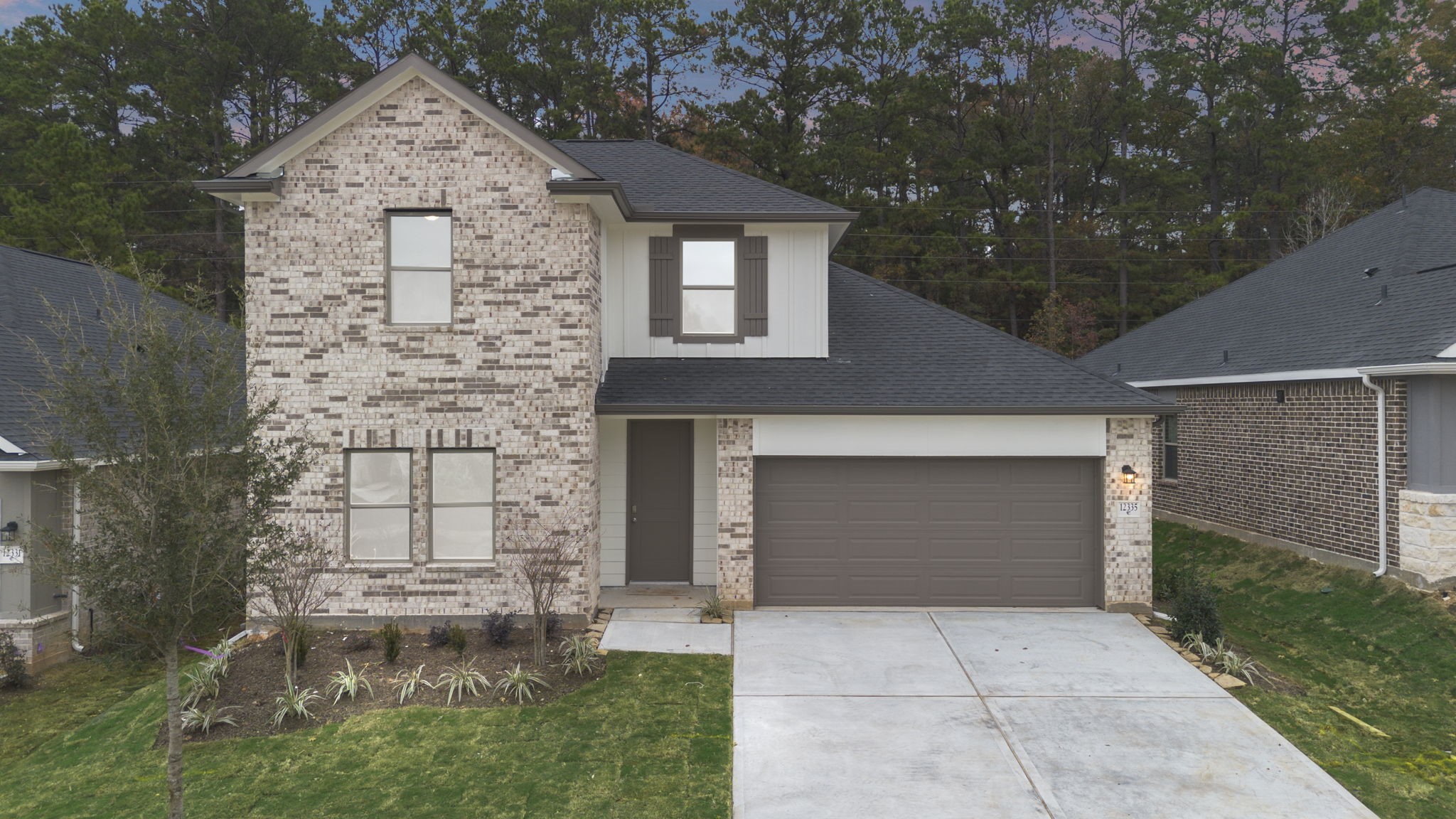front view of a house with a yard