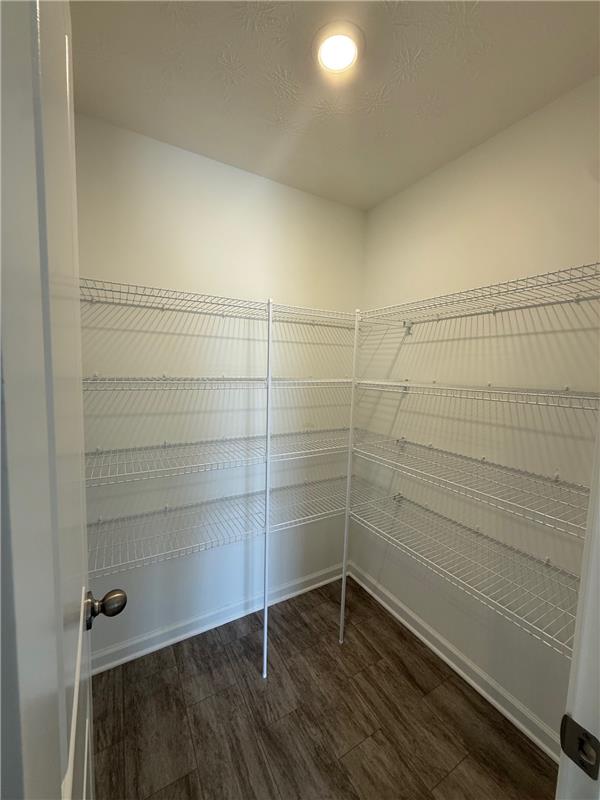 4005 Chakeres Avenue Springfield, OH 45505 - Photo 8 of 19 This spacious pantry features ample wire shelving and durable flooring for optimal storage.