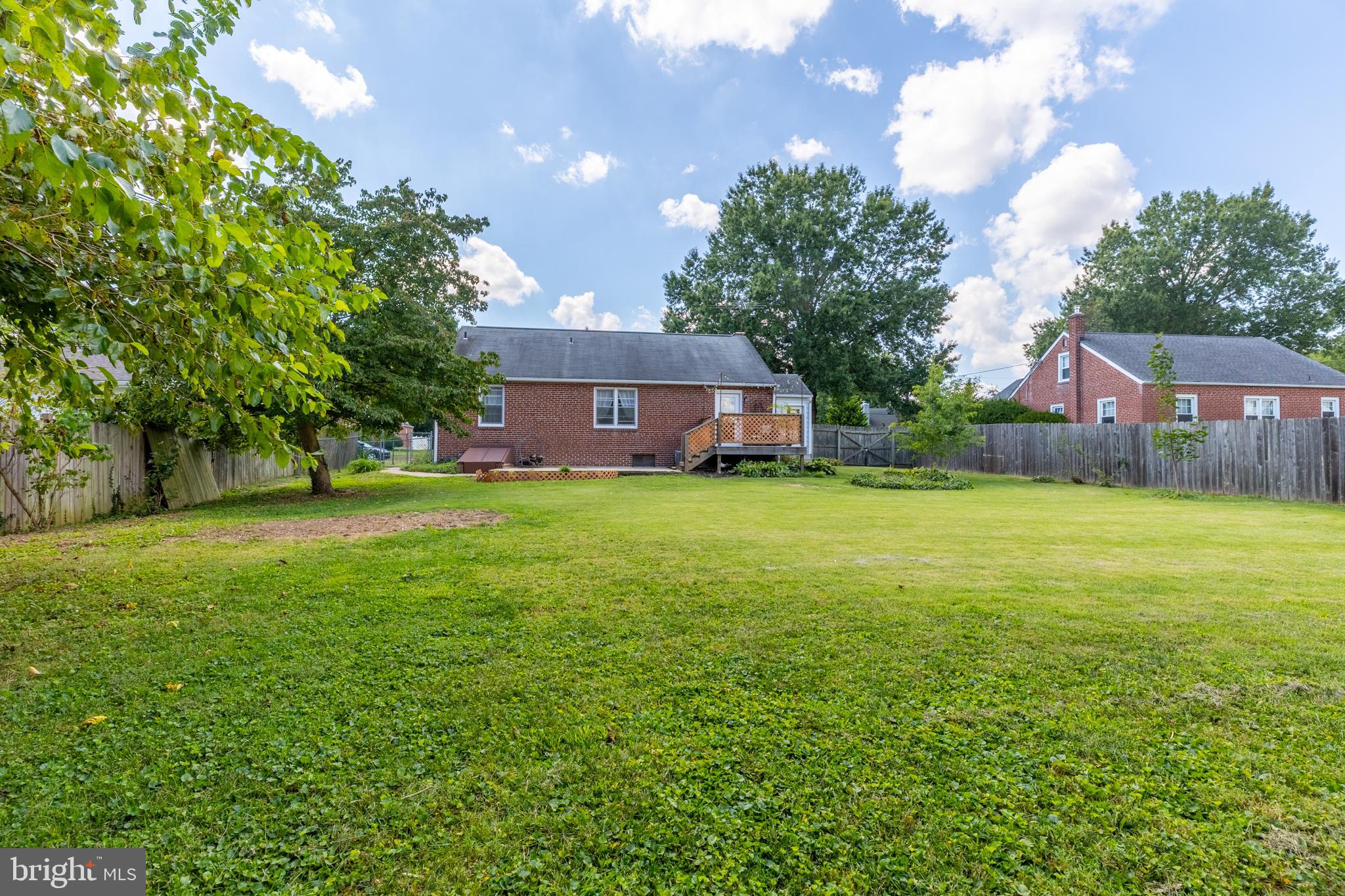 5 Lehigh Road Wilmington, DE 19808 - Photo 17 of 17 a view of a house with a big yard and large trees