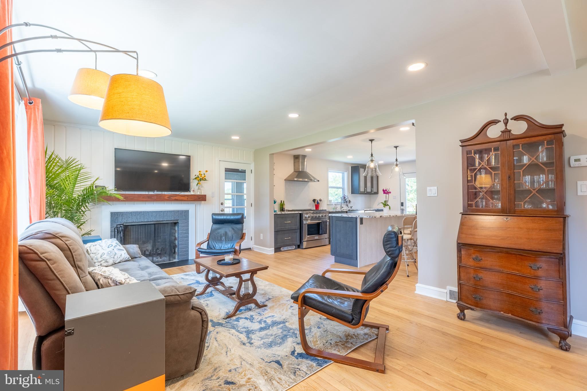 5 Lehigh Road Wilmington, DE 19808 - Photo 3 of 17 a living room with fireplace furniture and a lamp