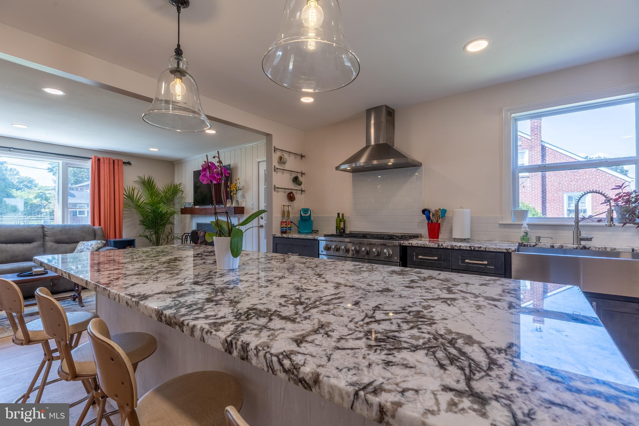 5 Lehigh Road Wilmington, DE 19808 - Photo 7 of 17 a kitchen with stainless steel appliances granite countertop a sink a stove and a wooden cabinets