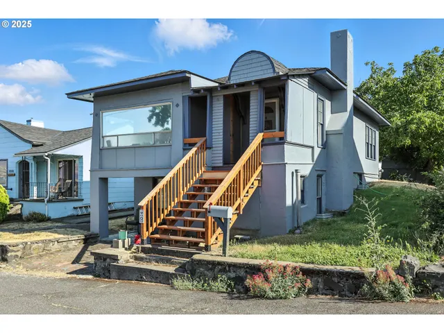 a lobby with furniture and floor to ceiling window