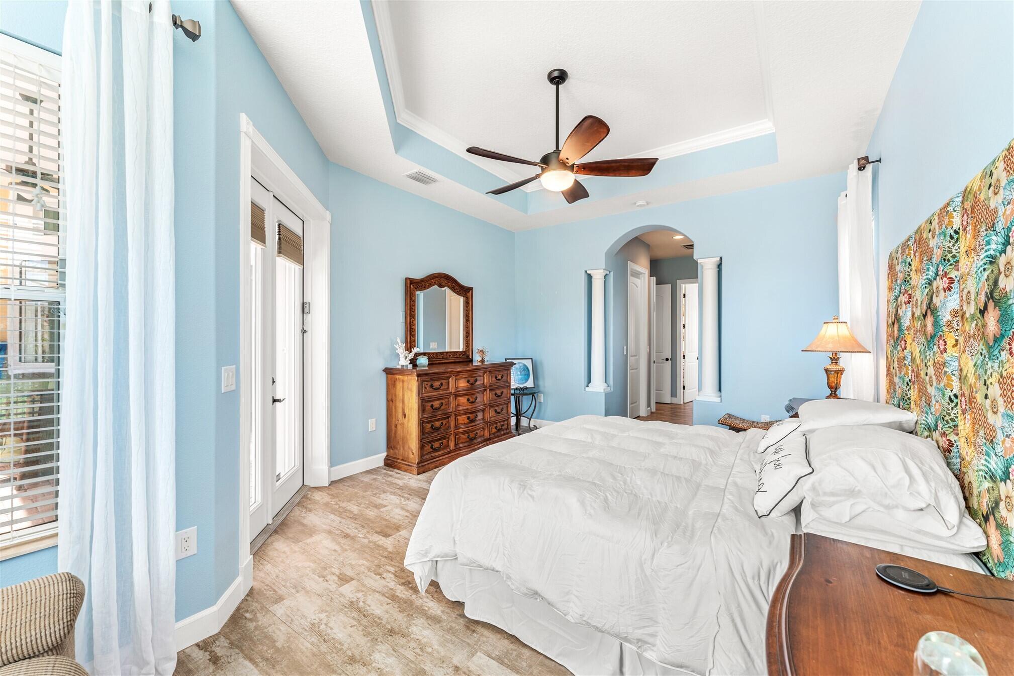 3210 Levanto Drive Melbourne, FL 32940 - Photo 22 of 76 a bedroom with a bed dresser and a large window