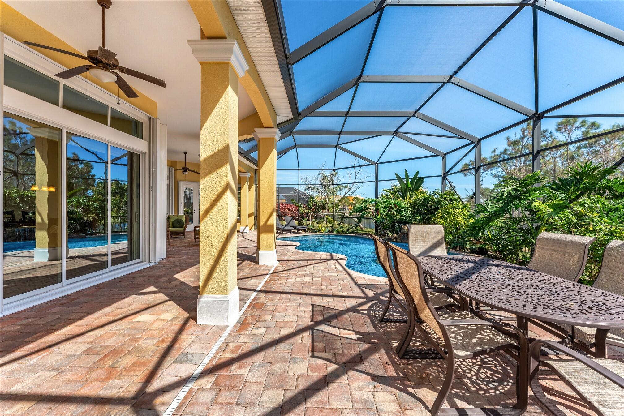 3210 Levanto Drive Melbourne, FL 32940 - Photo 49 of 76 a view of a patio with a table and chairs