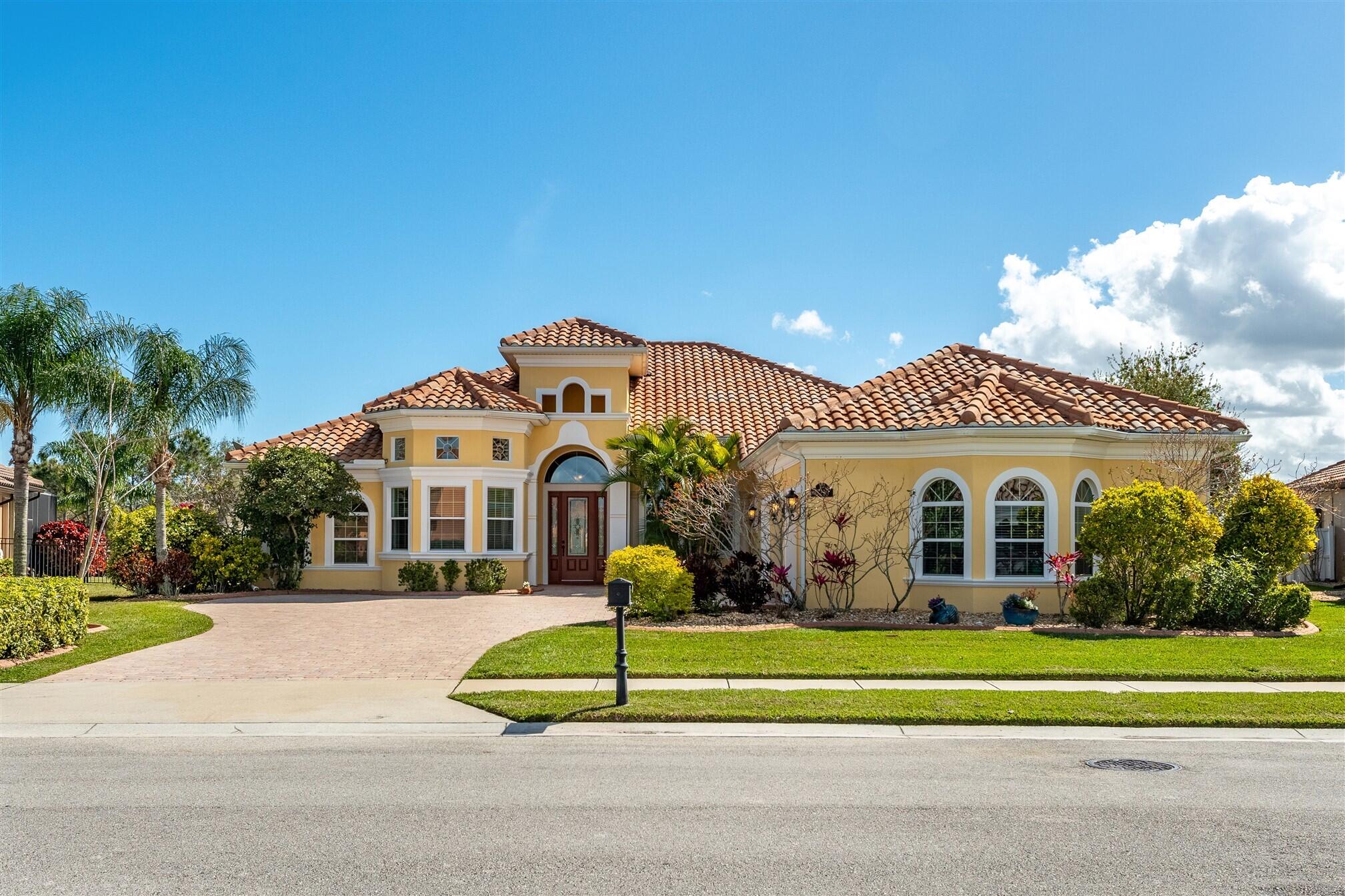 3210 Levanto Drive Melbourne, FL 32940 - Photo 72 of 76 a front view of a house with a yard