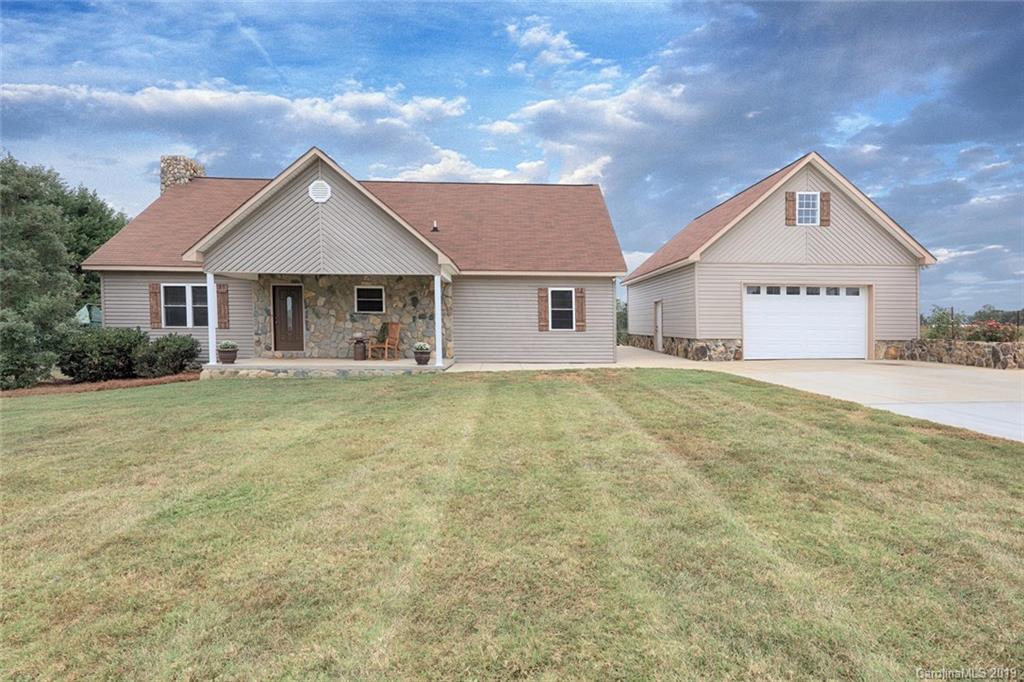 166 Stikeleather Road Stony Point, NC 28678 - Photo 1 of 48 a front view of a house with garden