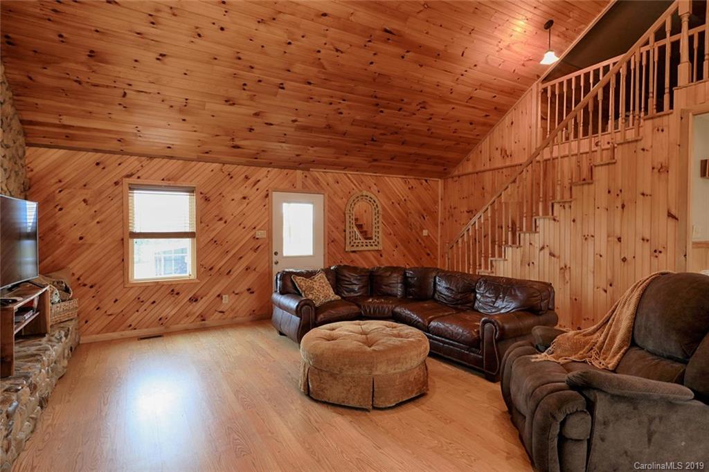 166 Stikeleather Road Stony Point, NC 28678 - Photo 11 of 48 a living room with furniture and a wooden floor