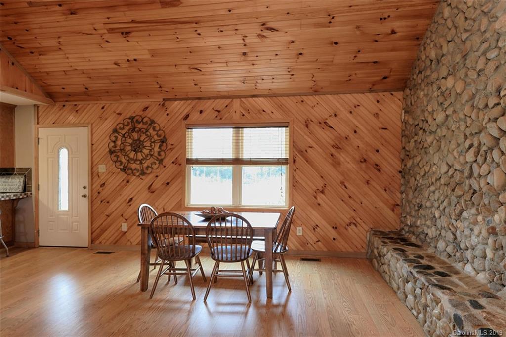 166 Stikeleather Road Stony Point, NC 28678 - Photo 12 of 48 a dining room with furniture and wooden floor