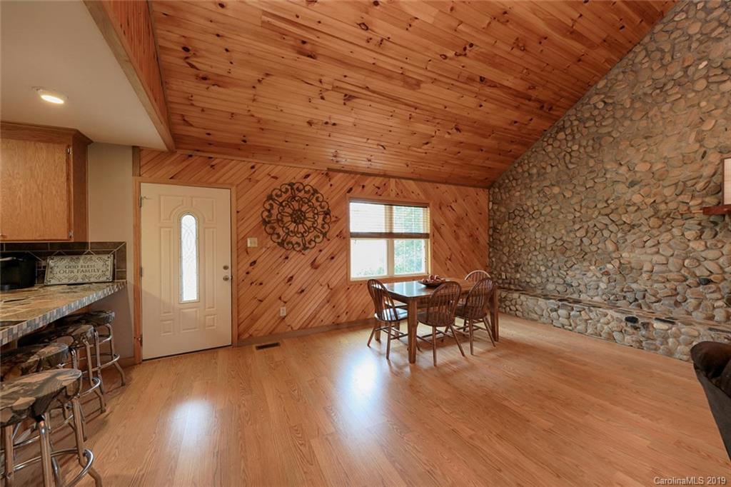 166 Stikeleather Road Stony Point, NC 28678 - Photo 13 of 48 a dining room with furniture and wooden floor