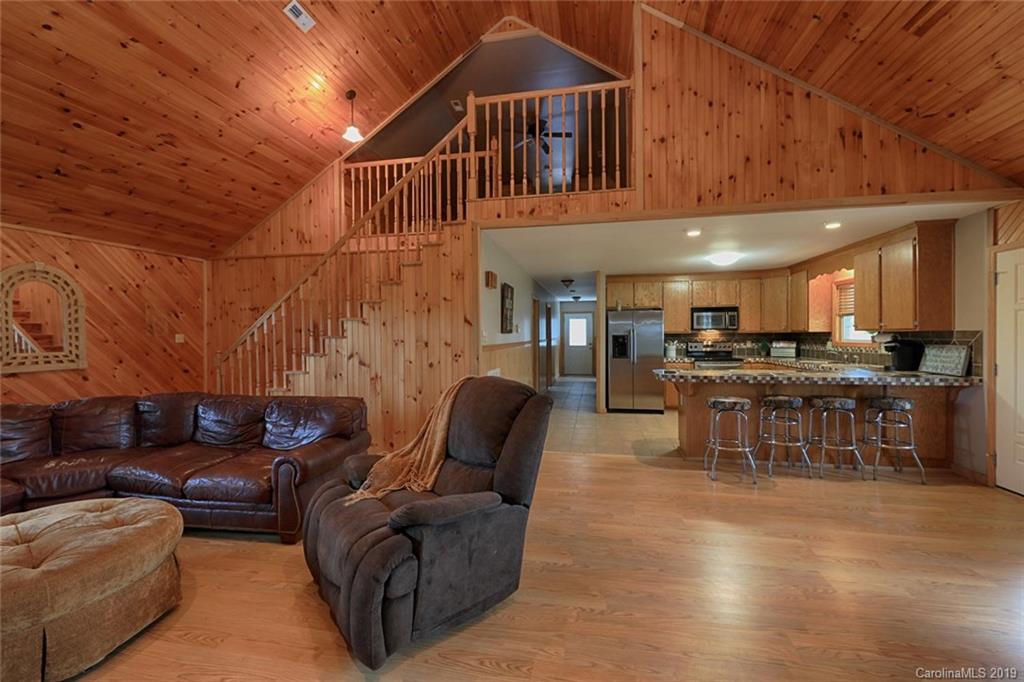 166 Stikeleather Road Stony Point, NC 28678 - Photo 14 of 48 a living room with furniture and kitchen view