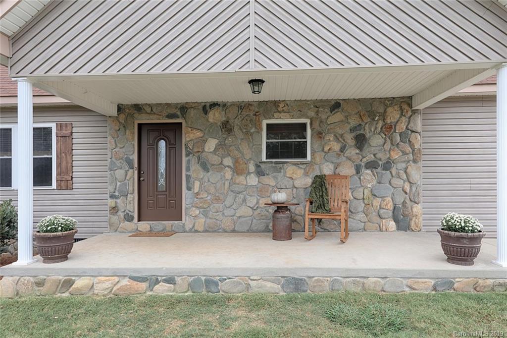 166 Stikeleather Road Stony Point, NC 28678 - Photo 3 of 48 a front view of a house with chairs