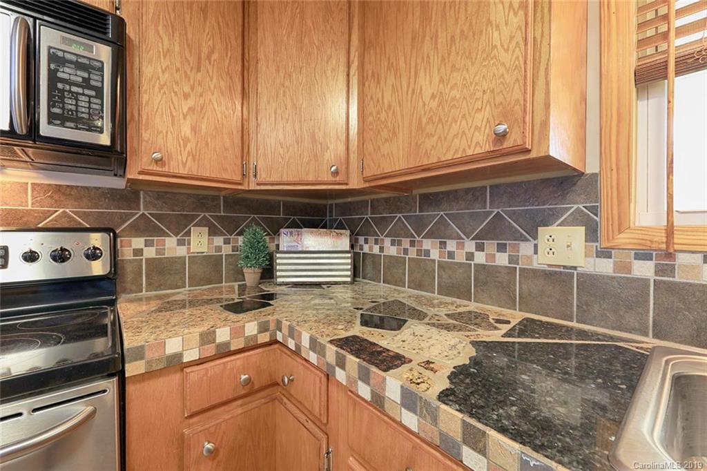 166 Stikeleather Road Stony Point, NC 28678 - Photo 22 of 48 a kitchen with a stove and a sink