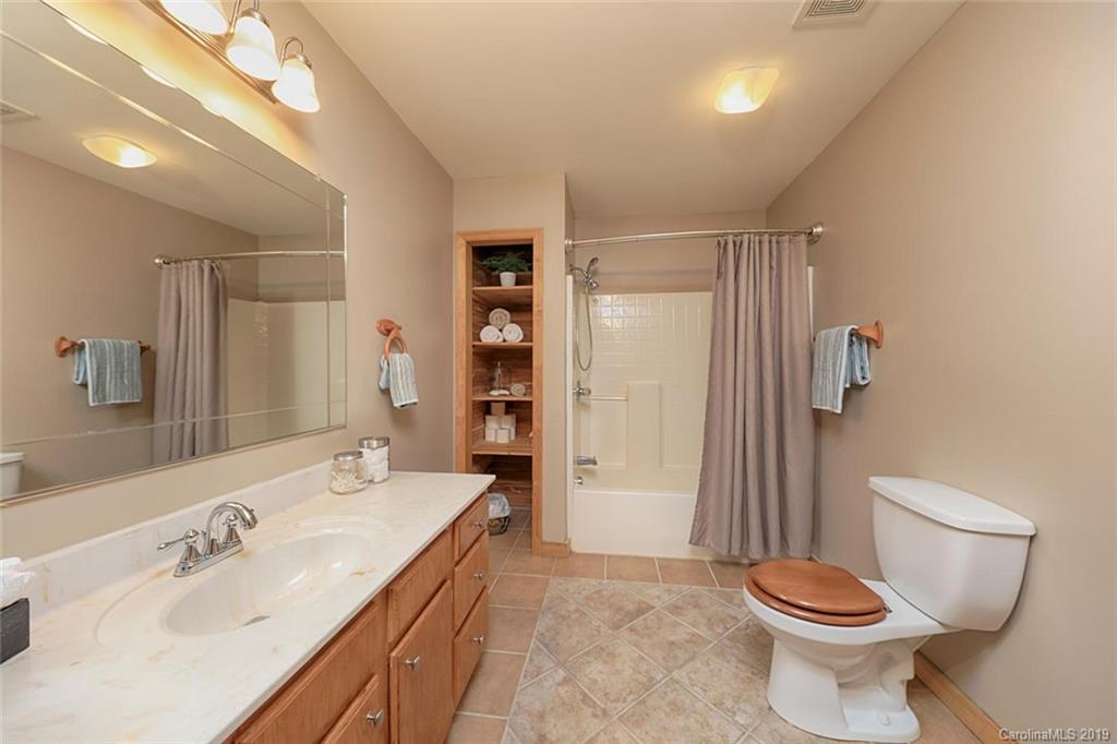 166 Stikeleather Road Stony Point, NC 28678 - Photo 26 of 48 a bathroom with a sink toilet and shower