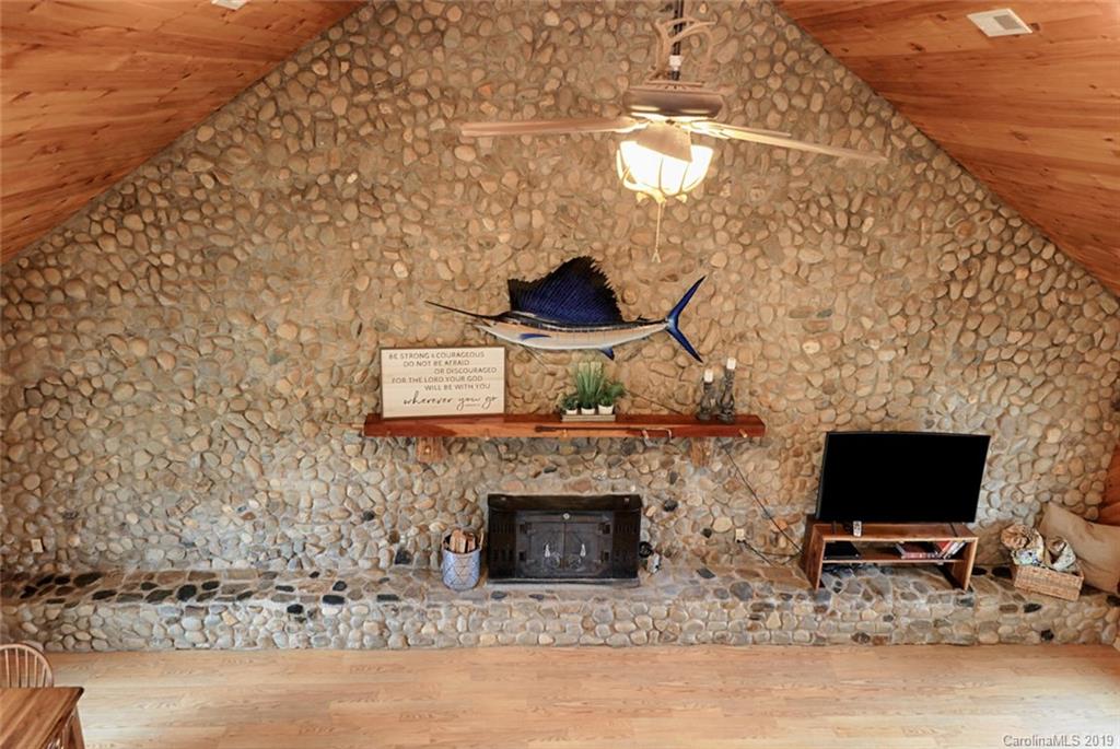 166 Stikeleather Road Stony Point, NC 28678 - Photo 29 of 48 a living room with furniture and a fireplace