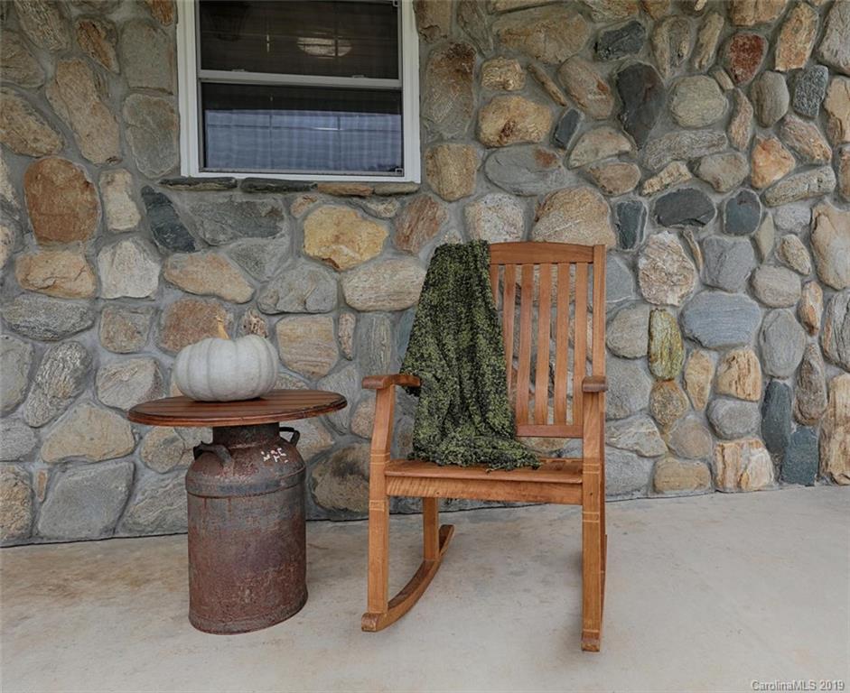 166 Stikeleather Road Stony Point, NC 28678 - Photo 4 of 48 a room that has a bench and a table in it