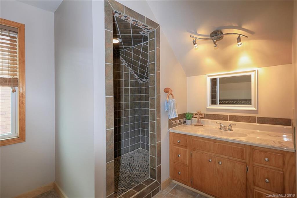 166 Stikeleather Road Stony Point, NC 28678 - Photo 34 of 48 a bathroom with a sink and a mirror