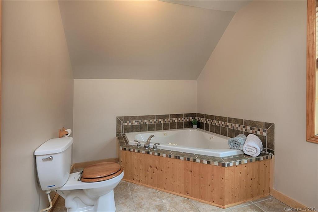166 Stikeleather Road Stony Point, NC 28678 - Photo 35 of 48 a bathroom with a bathtub and toilet