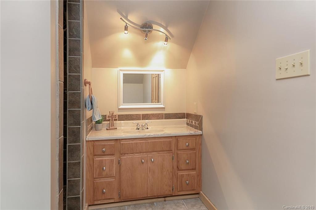 166 Stikeleather Road Stony Point, NC 28678 - Photo 36 of 48 a bathroom with a sink and a mirror